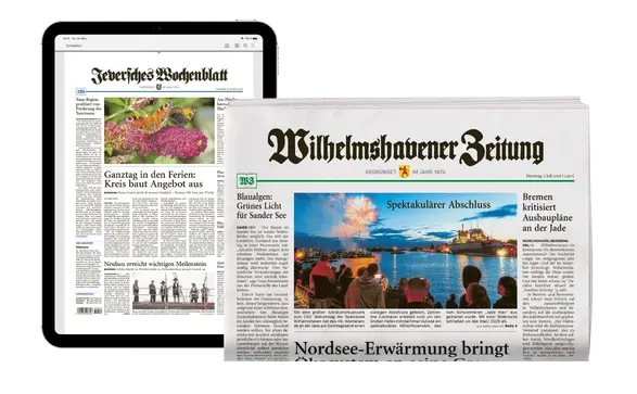 Tablet mit einer Artikelseite und eine Zeitungsrolle der Wilhelmshavener Zeitung