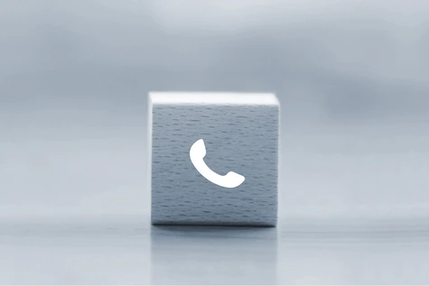 Holwürfel mit Telefon-Symbol